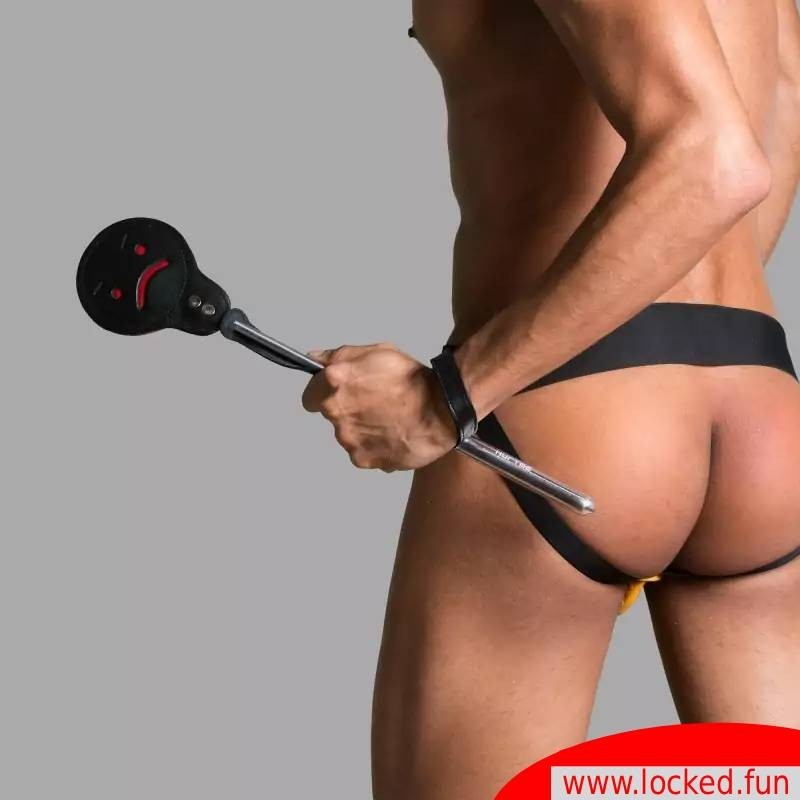 Paddle « Naughty or Nice » en cuir et aluminium.